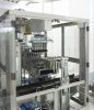 Unpacking/packing machines